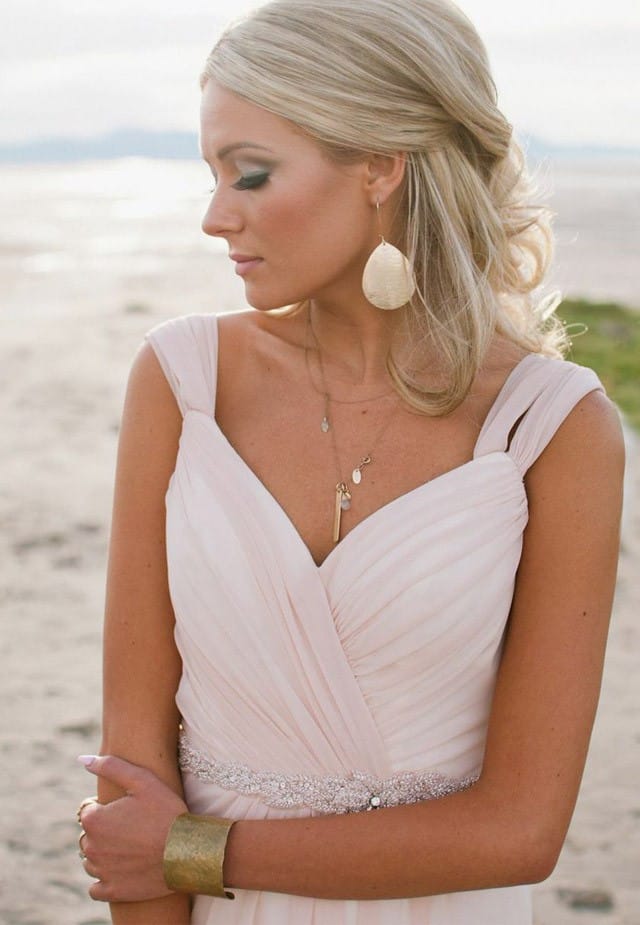 Blush wedding dress paired with Grecian details.