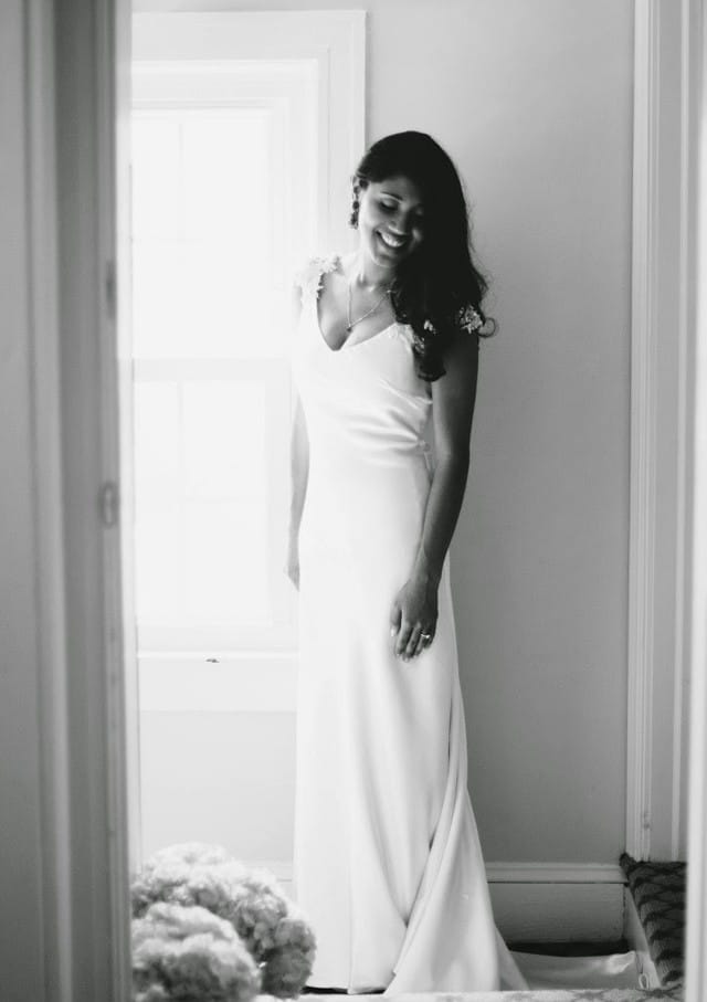 Real Bride, Jessica, wearing Oriana by Maggie Sottero, a silk sheath gown with glittering cap-sleeves.
