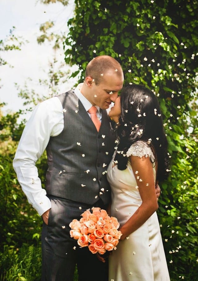 Real Bride, Jessica, wearing Oriana by Maggie Sottero, a silk sheath gown with glittering cap-sleeves.