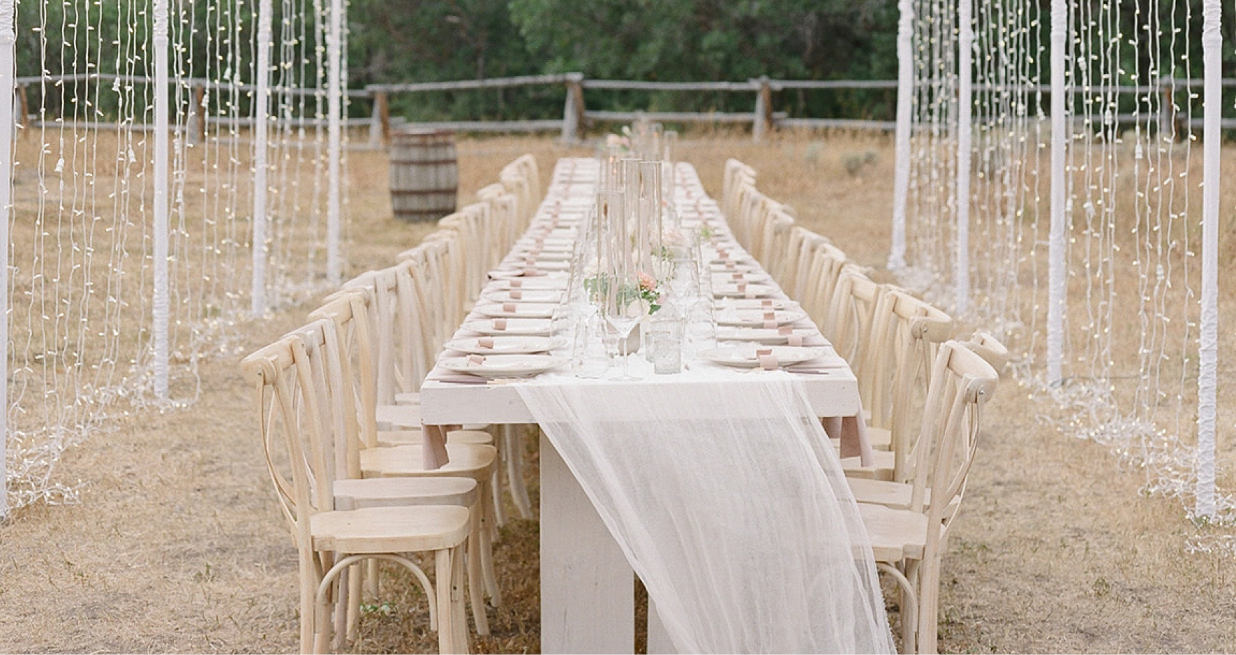 Outdoor Wedding Table Setting Under Fairy Lights